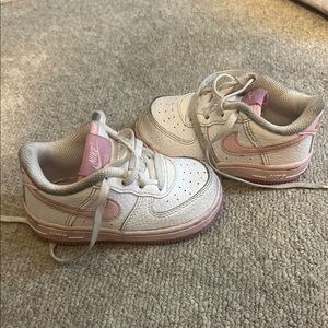Nike Pink and White Sneakers with Classic Design